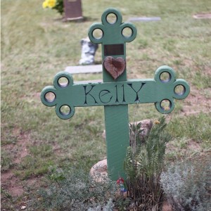 Wooden cross grave marker.