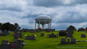 Water tower overlooking a cemetery
