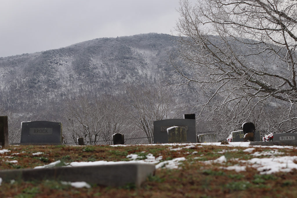 The snowy hills surrounding a Polk County, Tennessee Cemetery
